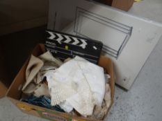 A box of table linen ETC Condition reports are provided on request by email only for this type of