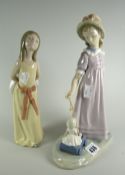 A Lladro figure of a young girl pulling a doll in a cart & another Condition reports are provided on