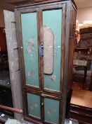 A vintage painted kitchen cupboard with character adaptations Condition reports are provided on