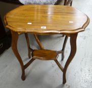 A two-tier antique mahogany occasional table with shaped top Condition reports are provided on