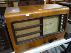 An Ekco vintage radio in a veneered case Condition reports are provided on request by email only for