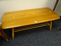A good Ercol blonde two-tier Long John coffee table Condition reports are provided on request by