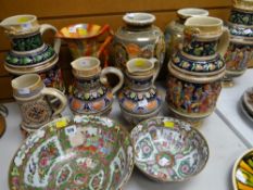 A collection of ornamental pottery steins, pair of Oriental-type baluster vases, pair of Famille
