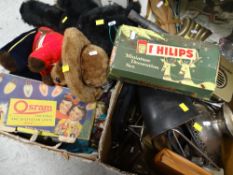 Two boxes of mixed items including old metal collectables, gaiters, soft toys ETC Condition
