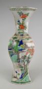 A good Chinese porcelain Famille Verte restored vase depicting figures & trees within landscape with