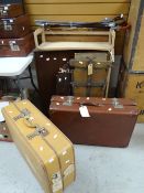 Two good vintage suitcases complete with travel labels, a vintage clothes press, open bookcase & a