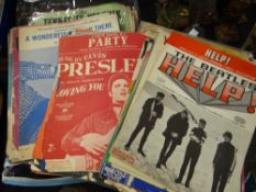 A quantity of twentieth century sheet music including The Beatles songs Condition reports are