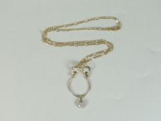 9ct yellow gold bow design pendant with seven stone diamond drop on 9ct yellow gold flat curb link
