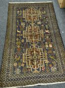 An Old Baluchi rug, 188 x 113cms Condition reports are provided on request by email only for this