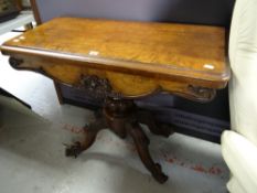 A good antique walnut foldover card table with carved spider base & carved frieze, 92cms wide