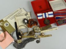 A small parcel of commemorative coins, wrist watches & jewellery ETC Condition reports are