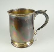 A plain silver bell-shaped mug, with later presentation inscription to base, London 1930, 12.3oz