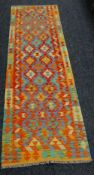 A vegetable dye wool Choli Kelim runner, 245 x 77cms Condition reports are provided on request by