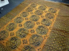 A large mustard ground antique Persian carpet, 260 x 345cms