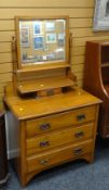 A vintage three-drawer dressing table with swivel mirror & jewellery drawer Condition reports are