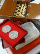 A vintage travel chess set, sundry 1972 Chess Olympics medallions, a 1972 Olympiad for chess