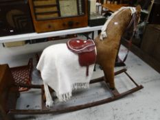 A late twentieth century felt covered child's nursery rocking horse Condition reports are provided