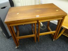 An AH McIntosh mid-century teak nest of tables, the parent being fold-over Condition reports are
