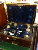 An antique rosewood cased vanity set complete with leather outer case Condition reports are provided