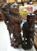 Two Oriental carved wooden figures Condition reports are provided on request by email only for