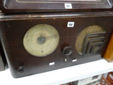 An Art Deco period vintage radio Condition reports are provided on request by email only for this
