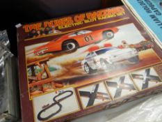 A Dukes of Hazzard Electric Slot Racing set in original box Condition reports are provided on