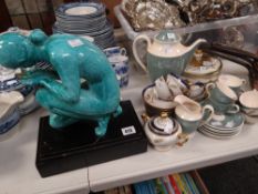 A pottery figure of a crouching lady & a parcel of continental teaware ETC Condition reports are