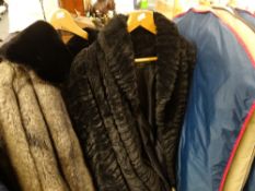 A collection of four full length fur coats together with a vintage full length knitted coat