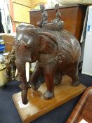 A silver rimmed horn beaker with inscription, a carved wooden elephant & a parcel of metallic