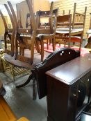 An oval reproduction breakfast table with chairs, pair of Stag Minstrel or similar bed ends & a Stag