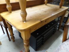 A farmhouse pine table & a stained four-drawer plan chest Condition reports are provided on