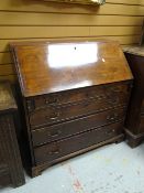 An antique mahogany bureau having four graduated drawers & pigeon hole / drawer interior Condition
