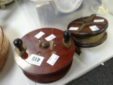 A believed Bakelite fishing reel & an antique wooden & brass mounted fishing reel Condition