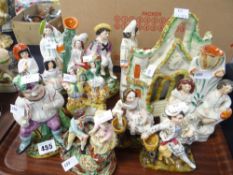 A parcel of mainly Staffordshire figures and pair of porcelain figures of gilded musicians Condition