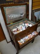 A vintage sewing box & contents including large quantity of old cotton reels Condition reports are
