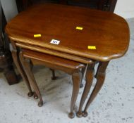 Nest of three dark wood tables