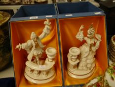 A pair of porcelain figures in non-matching Royal Doulton display cases Condition reports provided