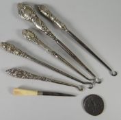 Parcel of silver handled button hooks ETC Condition reports provided on request by email for this