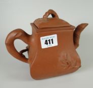 An Oriental redware terracotta pottery teapot Condition reports provided on request by email for