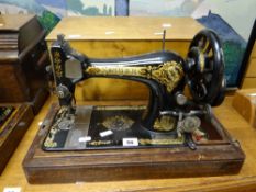 A vintage cased Singer sewing machine Condition reports provided on request by email for this