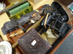 A vintage cased set of Krombach binoculars, a vintage toffee tin, two carved figures ETC Condition