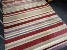 A John Lewis hand loomed wool pile rug in the Cranberry Multi-Stripe pattern, 240 x 170cms Condition