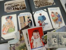 An album of vintage postcards, mainly British topographical & some humorous together with a tin