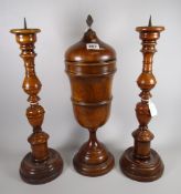 An antique Lignum Vitae garniture trio Condition reports provided on request by email for this