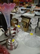 A fancy tinted glass epergne on a white metal bird mounted circular base & two cut glass decanters