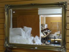 A wall mirror in a fancy reproduction gilt frame (damage) Condition reports provided on request by