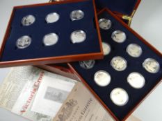 A cased set of eighteen Elizabeth II (2006) commemorative coins for Victoria Cross Awardees plus