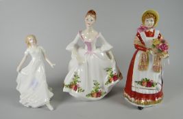 A Royal Doulton figurine 'Old Country Roses' - HN3692 together with a Royal Doulton figure '