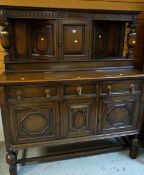 A 1920s dark oak court dresser, 170(h) x 155(l) x 61(d)cms