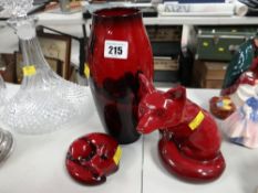 A Royal Doulton Flambé vase decorated with a ploughing scene & two Royal Doulton Flambé fox